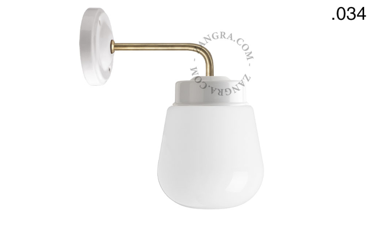 Retro white porcelain wall light with glass shade.