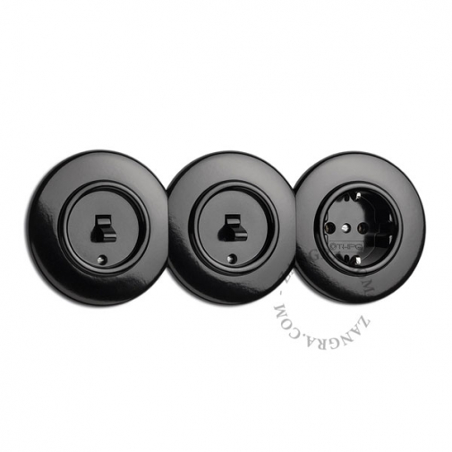 Black bakelite cover for switches and outlets.