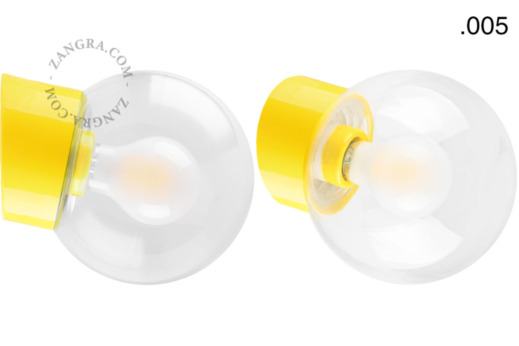 Yellow porcelain wall light with glass lampshade.