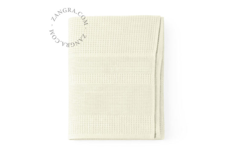 Beige honeycomb bath towel.