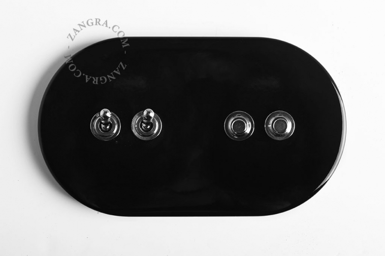 Black switch with 2 nickel-plated toggles and 2 pushbuttons.