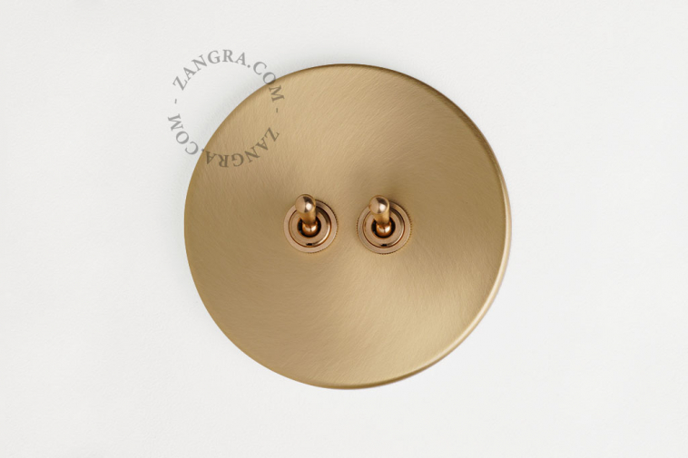 Brass switch with double brass toggle.