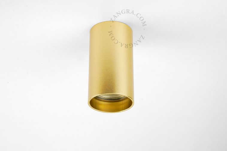 Surface-mounted cylindrical spotlights.