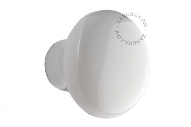 Round white porcelain drawer knob.