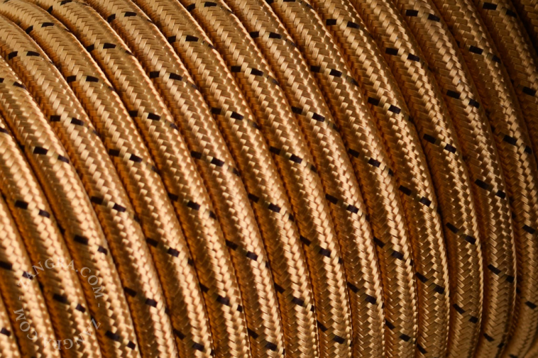 Golden fabric cable with brown dots.