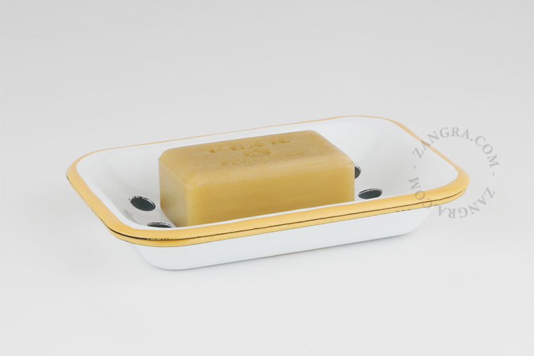 White enamel soap dish with caramel yellow rim.