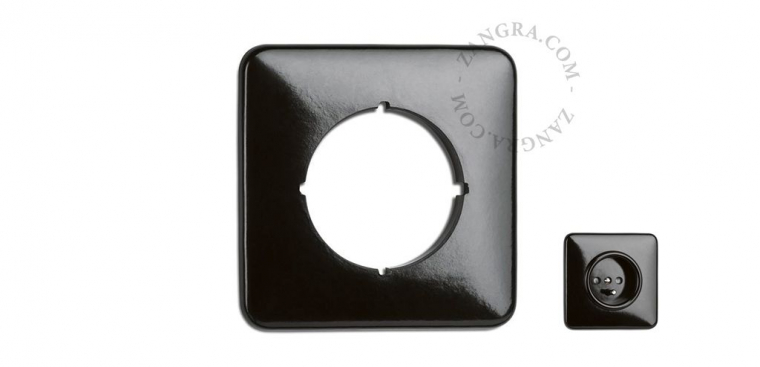 Black bakelite cover for switches and outlets.