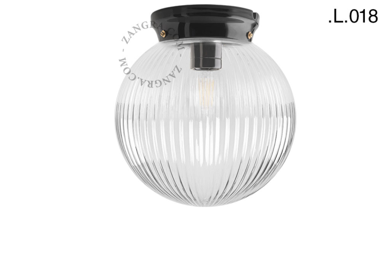 Black porcelain Art Deco light with glass shade.