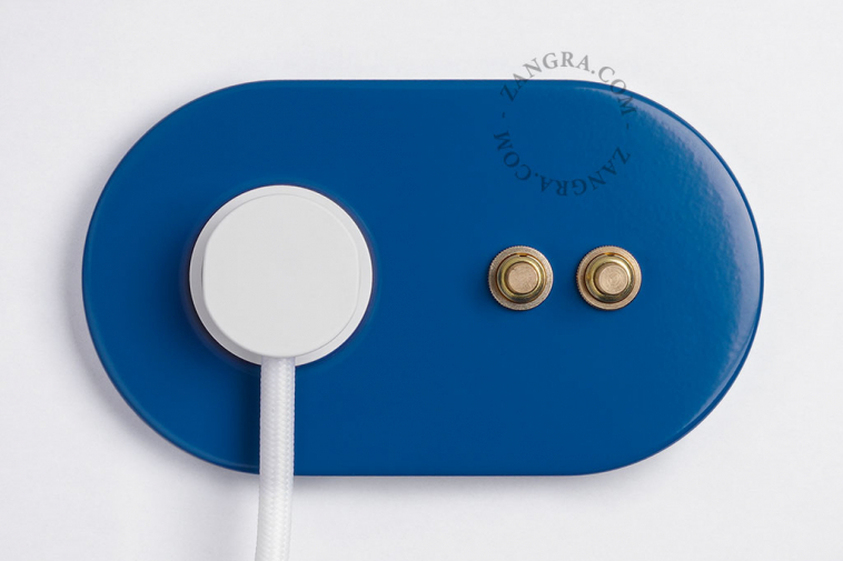 2 gold push buttons on blue integrated outlet