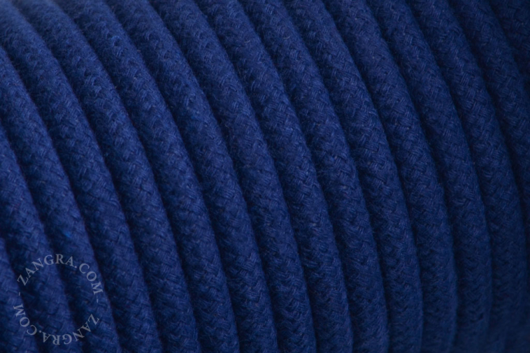 Electrical cable covered in navy blue cotton.