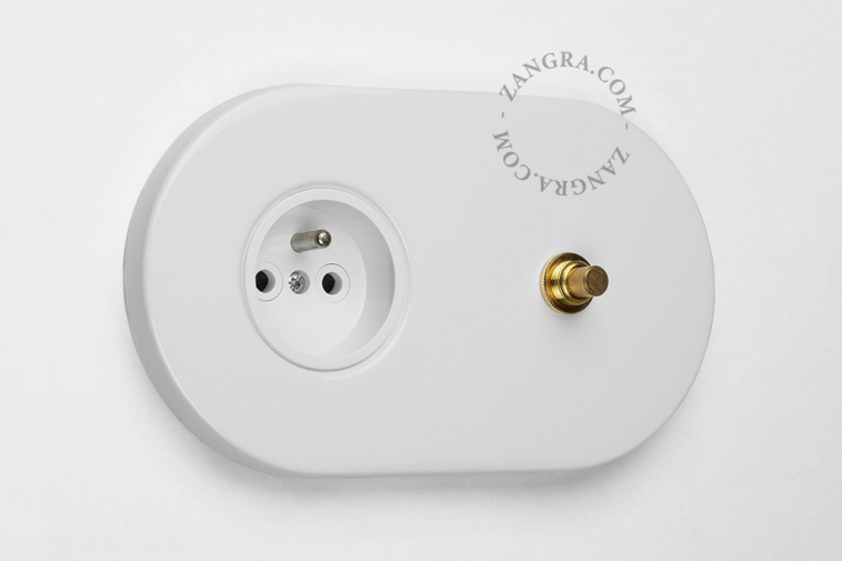 white flush mount outlet & switch – raw brass pushbutton
