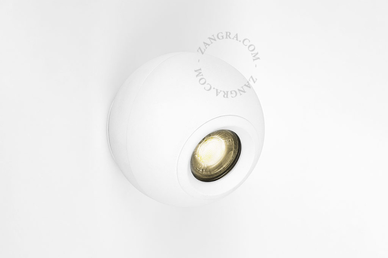 Adjustable and dimmable surface-mounted spotlight.