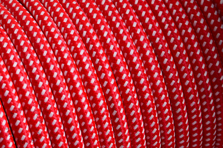 Red fabric cable with white dots.
