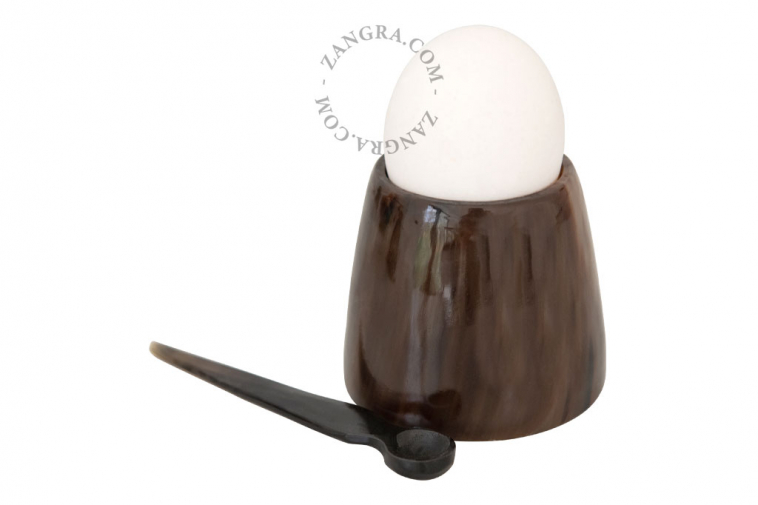small multi-purpose horn egg cup containing a small  horn spoon