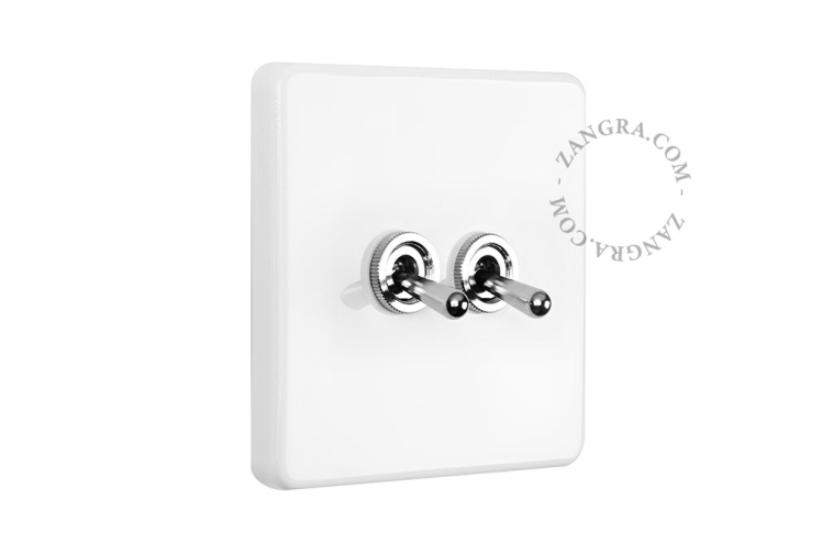 White porcelain square-shaped switch.