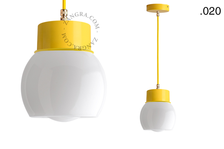 Yellow pendant light with glass shade.