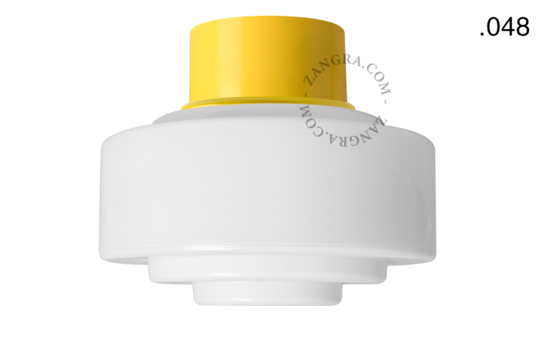 Yellow ceiling light with glass shade.