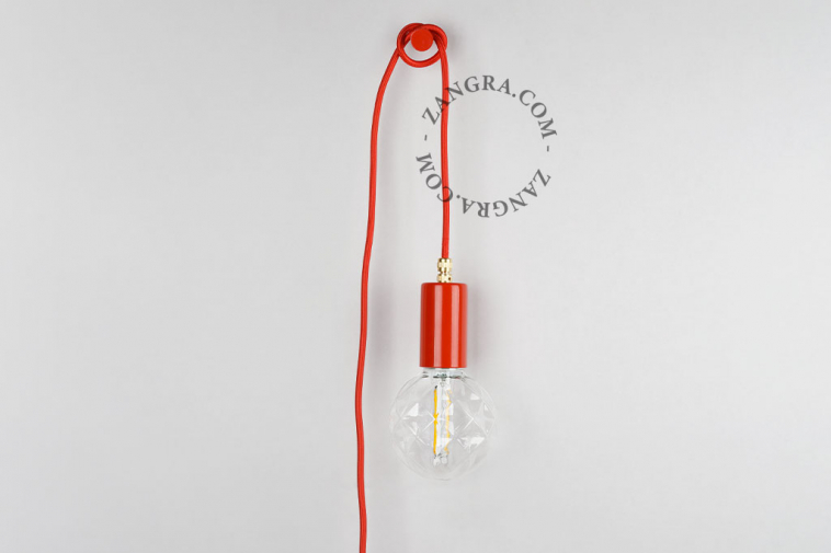 Red plug-in pendant light with switch and plug.