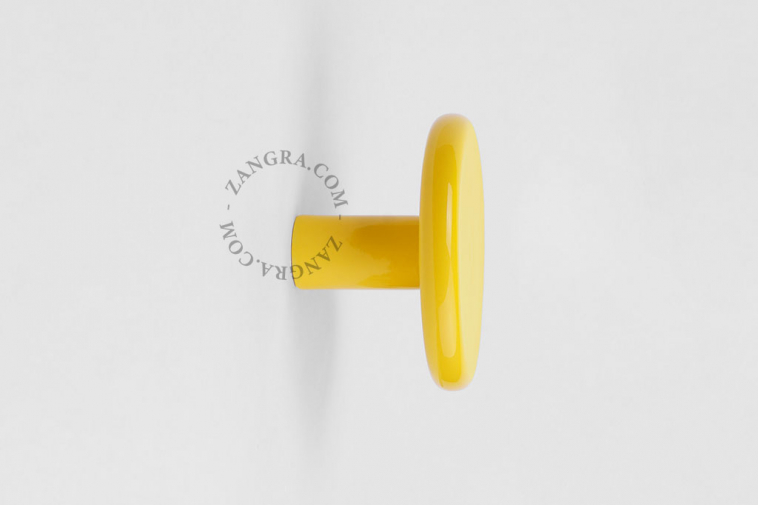 yellow porcelain coat hook or door knob