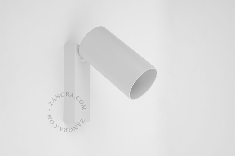 Cylinder-shaped surface spot with light switch in white color.