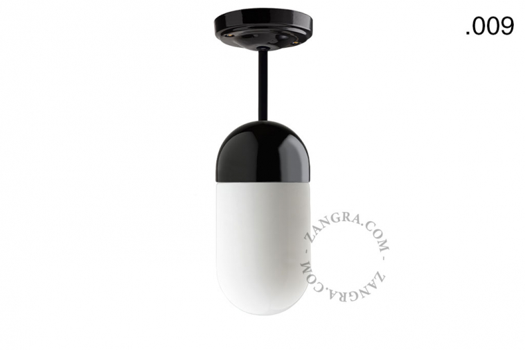 Black porcelain ceiling light with glass shade.