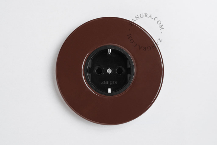 Brown flush mount round outlet.