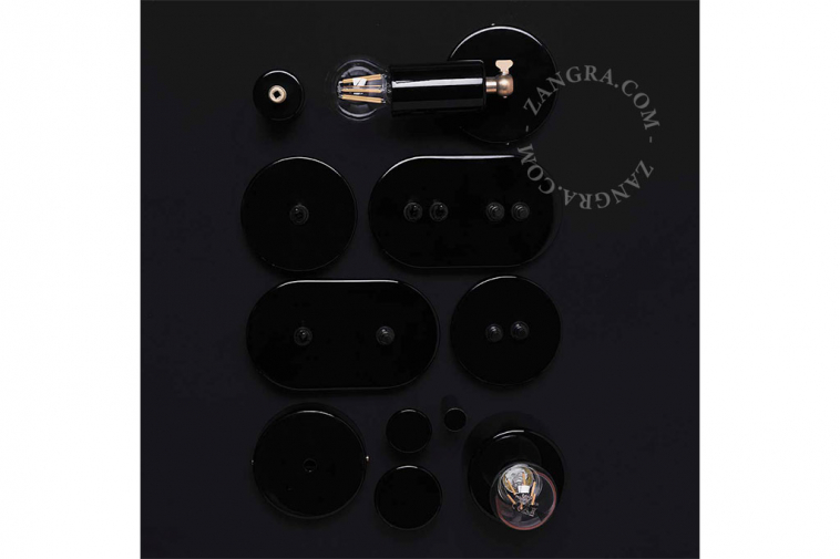 Round black double pushbuttons.